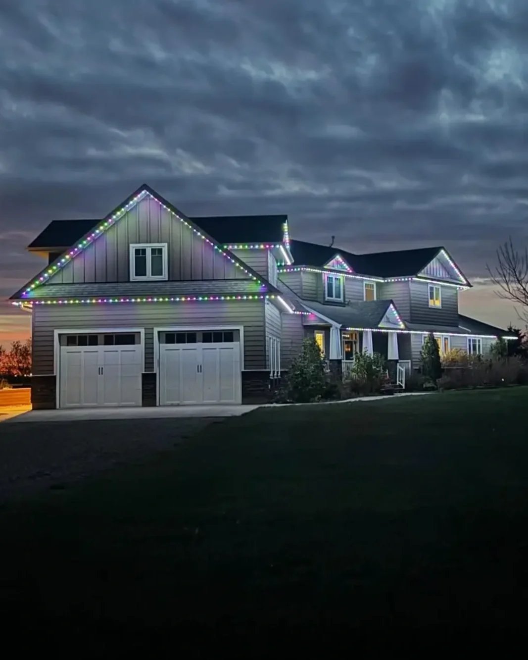Thunder Bay home with Klix permanent LED lighting at dusk