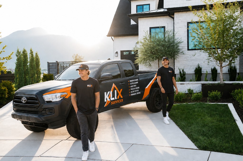 Two Klix technicians walking in front of the wrapped truck in Thunder Bay