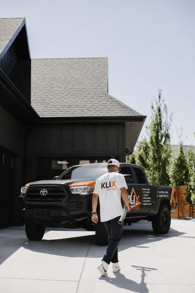 Klix technician walking toward the branded company truck after a Thunder Bay job