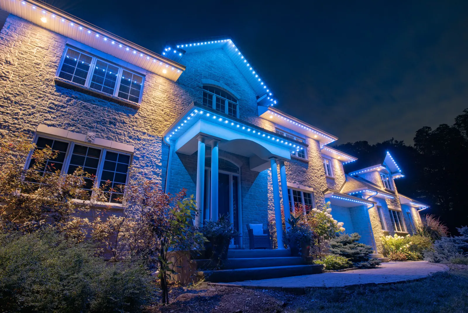 Thunder Bay home outlined in blue permanent LED lighting