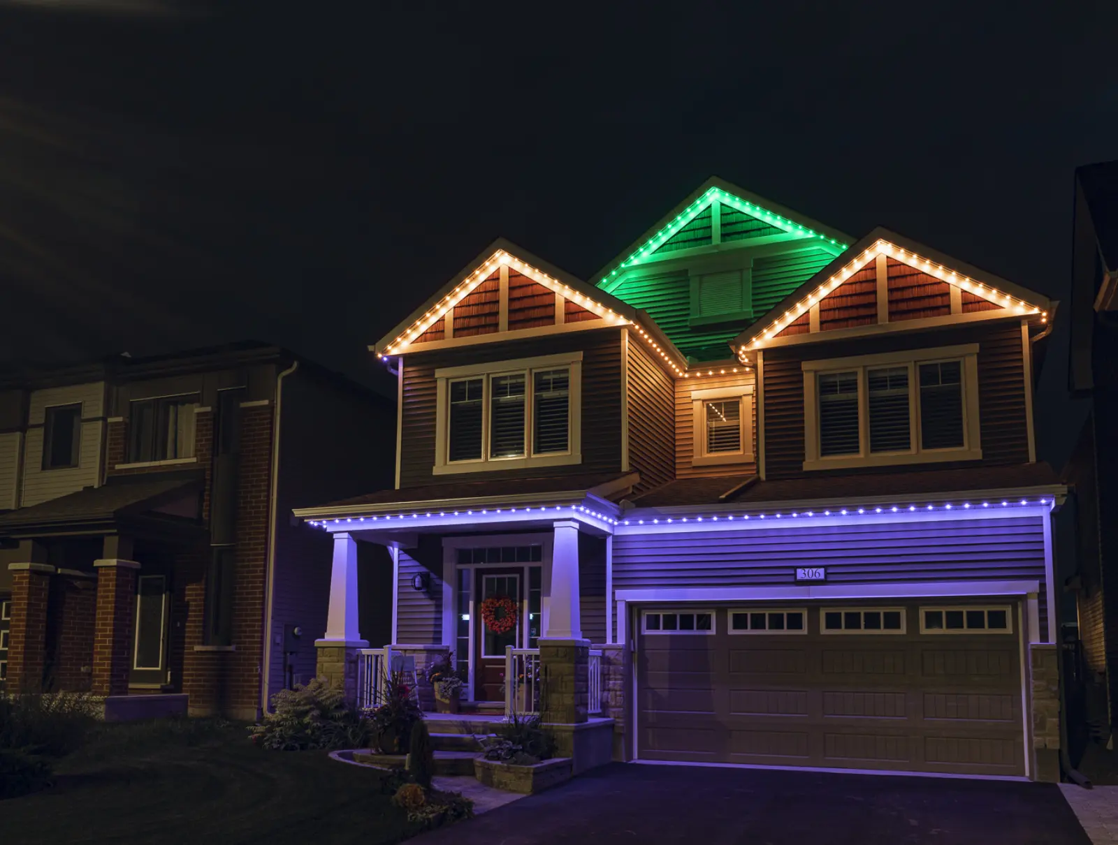 Halloween-coloured permanent lighting on a Thunder Bay home