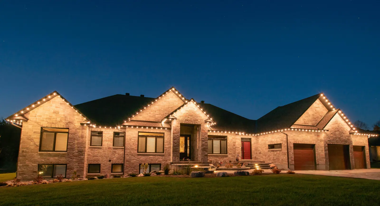 Warm white permanent lighting on a Thunder Bay home